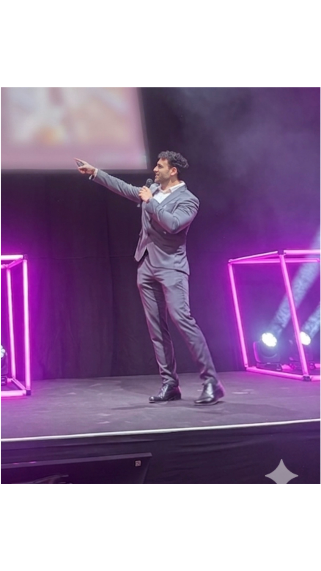 Verdi Poggi speaking on stage